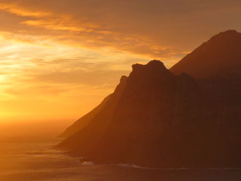 Scenic view of mountains against sky during sunset