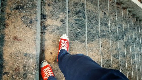 Low section of man standing on floor