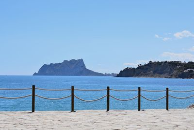 Scenic view of sea against blue sky