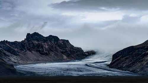 Scenic view of mountains against sky during winter