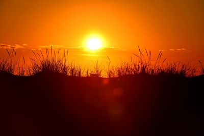 Scenic view of silhouette landscape against sky during sunset