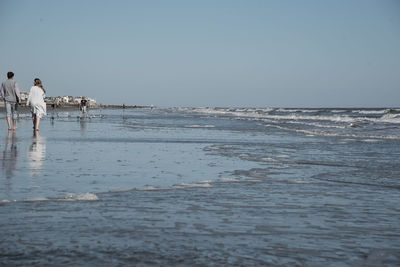 Scenic view of beach against clear sky