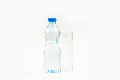 Close-up of glass bottle against white background