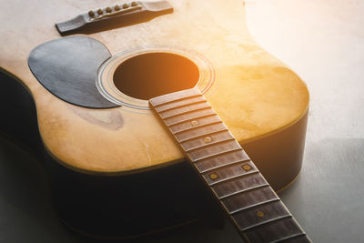 High angle view of guitar on table