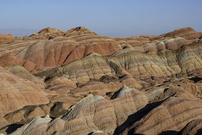 Rock formations in desert against sky