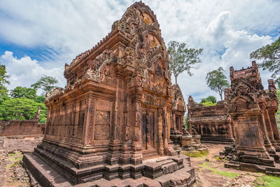 Low angle view of old temple building against sky