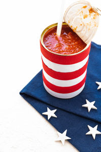 Close-up of canned food on tablecloth