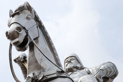 Low angle view of statue against sky