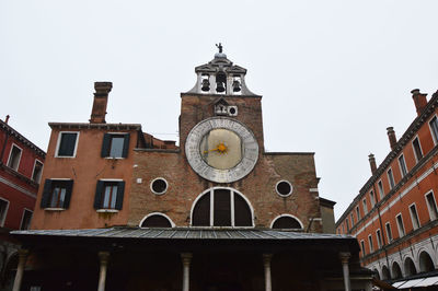 Low angle view of clock tower against sky