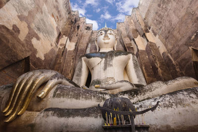 Low angle view of statue against building