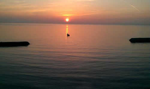 Scenic view of sea at sunset