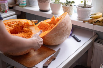 Cropped hand of man holding food