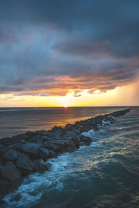 Scenic view of sea against sky during sunset