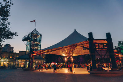 People in city against clear sky