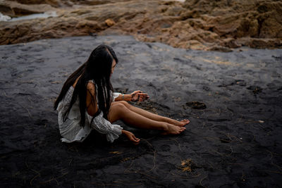 Woman sitting on beach