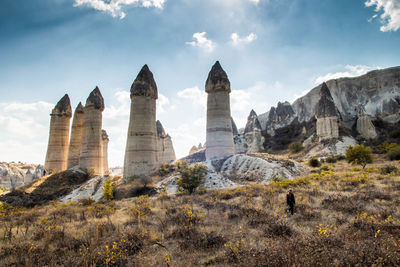 Panoramic view of rock formations against sky