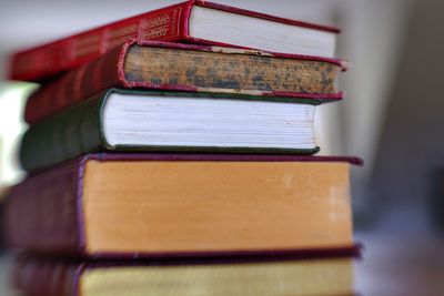 Close-up of stack of old hardcover books