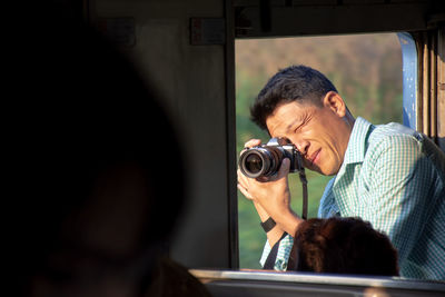 Close-up of man photographing