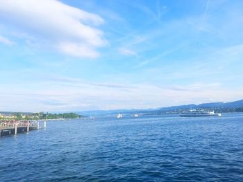 Scenic view of sea against blue sky