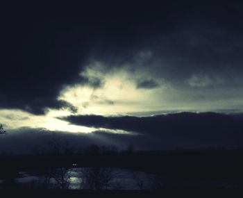 Scenic view of lake against cloudy sky