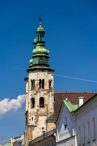 Low angle view of historic building against blue sky