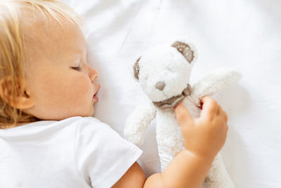 Portrait of cute baby girl with teddy bear