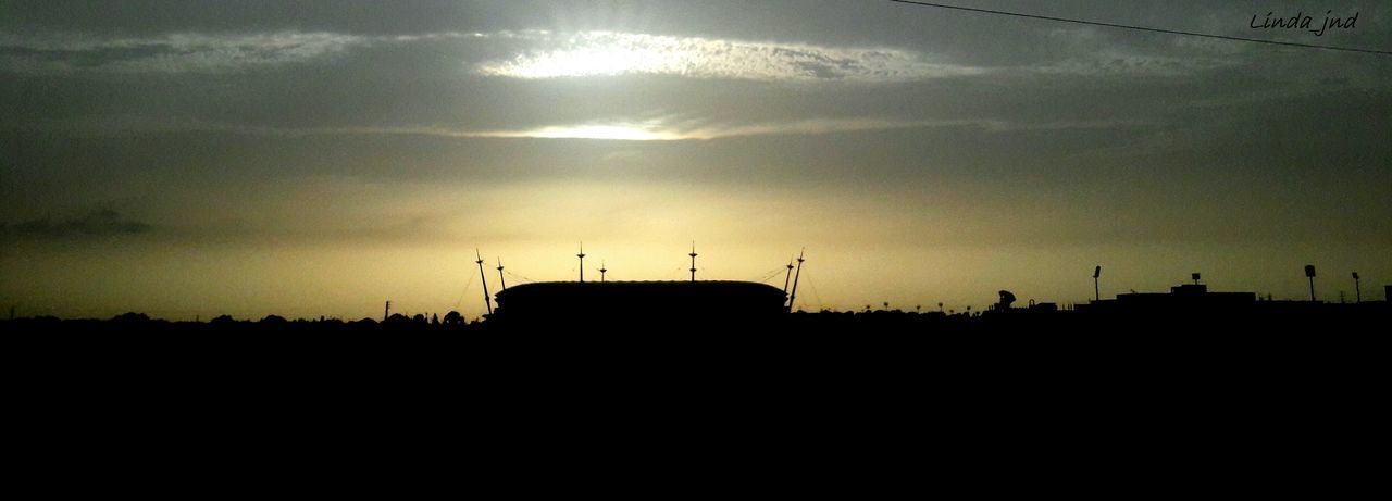 SILHOUETTE OF BUILDING AGAINST SKY DURING SUNSET