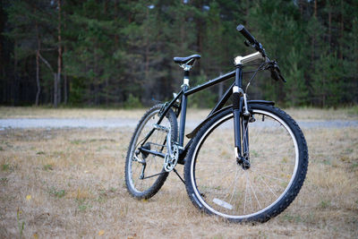 Bicycle parked on field