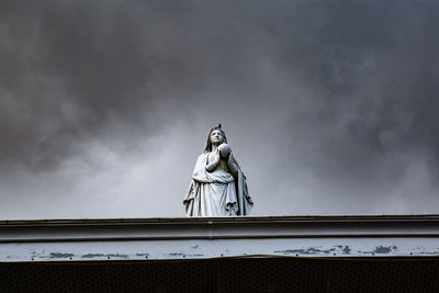 Low angle view of statue against sky