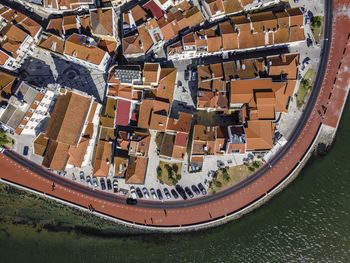 High angle view of river amidst buildings in city