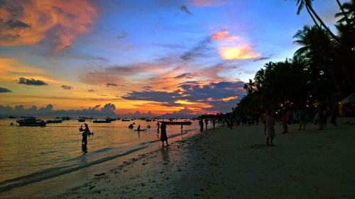 Scenic view of beach against sky during sunset