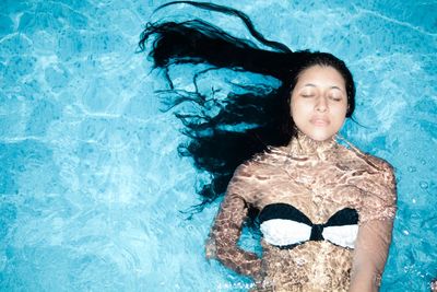 Directly above shot of woman in swimming pool