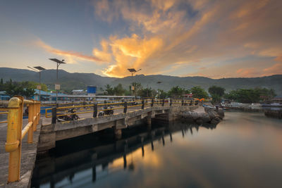 Scenic view of swimming pool against sky during sunset