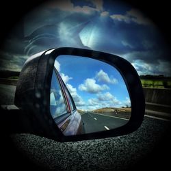 View of road against cloudy sky