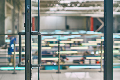 Close-up of open book on glass window of building