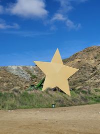 Christmas star decoration under a hill in the countryside