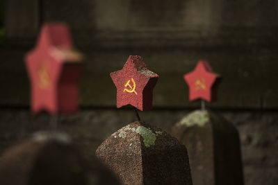 Close-up of cross against the wall