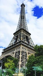 Low angle view of tower against cloudy sky