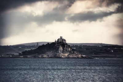 View of castle against cloudy sky