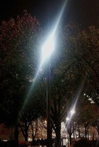 Low angle view of illuminated lights at night