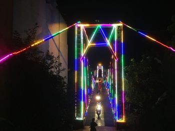 Light trails on illuminated city at night