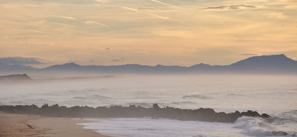 Scenic view of sea against sky during sunset