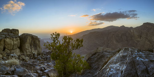 Scenic view of mountains against sky during sunset