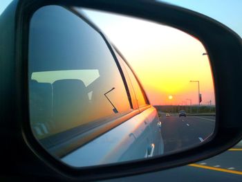 Reflection of sky on side-view mirror