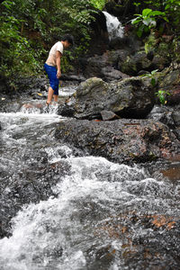 Man standing in river