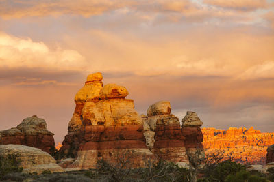 Sunset over red rocks in the maze utah desert