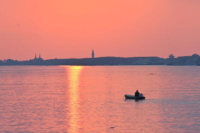 Scenic view of danube against sky during sunset