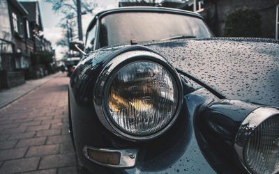 Close-up of vintage car on street