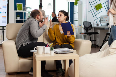 People sitting on chair at table