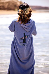 Rear view of woman on beach